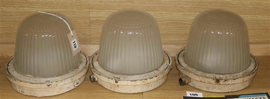 Three domed glass industrial lights